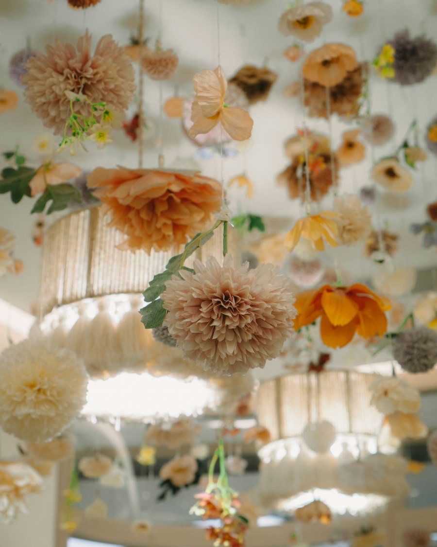 Suspended floral installation of dried and fresh blooms over an event space